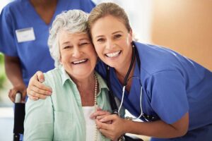 Caregiver and senior resident reviewing a personalized care plan at a table with notes and medication details.
